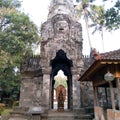 A place of worship for Buddhists with a stone building housing a statue of the Goddess at the Mendut Pawon temple in Magelang