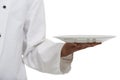 Place your food on this plate. an african chef holding a plate - Copyspace. Royalty Free Stock Photo