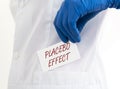 Placebo effect concept inscription. doctor hands with paper close up