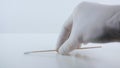 Placeing a swab for covid testing on a white surface. Royalty Free Stock Photo