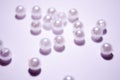 Placer beads. White beads. White artificial pearl beads. Imitation pearls. A pearl mound.