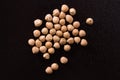 Placer chickpeas on a black background