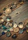 Placer of vintage buttons on aged boards
