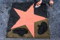 Placing a Coral Star on the Walkway in Hollywood