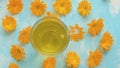 Placing down cup of calendula tisane