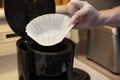 Placing filter into coffee pot Royalty Free Stock Photo