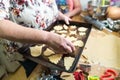 Placing homemade sugar cookie cutouts on a baking tray Royalty Free Stock Photo