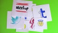 Placing pieces of paper with the logo of social networking. A variety of social networks and emoticons. Stop motion