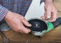 Placing Sanding Disk Holder onto Fastening Bolt of Angle Grinder.