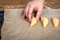 Placing Unbaked Pastries on Parchment Paper Lined Baking Tray Before Baking Royalty Free Stock Photo
