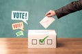 Placing a voting slip into a ballot box