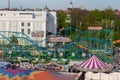 Plaerrer, Augsburg Germany, APRIL 22, 2019: view out of the ferris wheel over the Augsburger Plaerrer. A green rollercoast named Royalty Free Stock Photo