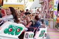 Plaerrer, Augsburg Germany, APRIL 22, 2019: young families enjoying their time with kids in a carnival ride