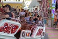 Plaerrer, Augsburg Germany, APRIL 22, 2019: young families enjoying their time with kids in a carnival ride Royalty Free Stock Photo