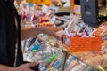 Plaerrer, Augsburg Germany, APRIL 22, 2019: young man buying candy on the a funfair