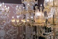 Plafond in the form of a blossoming flower bud on a crystal chandelier with pendants
