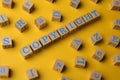 Plagiarism concept. Word Copyright made of wooden cubes with letters on yellow background