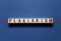 Plagiarism word concept on cubes