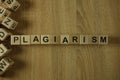 Plagiarism word from wooden blocks