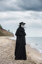 Plague doctor in seaside. Royalty Free Stock Photo