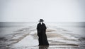 Plague doctor in seaside. Royalty Free Stock Photo