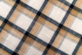 Plaid brown material. Texture or background of checkered fabric. Canvas. pattern Royalty Free Stock Photo
