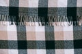 Plaid in a cell as a background image. Blank checkered fabric texture. Top view. Copy, empty space for text Royalty Free Stock Photo