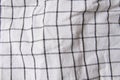 Plaid material. Towel on the table. Wrinkled fabric with stripes. Royalty Free Stock Photo