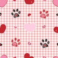 Plaid pattern baby pink with Valentine`s Day concept. Paw print with heart seamless fabric design Royalty Free Stock Photo