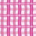 Gingham plaid checkered seamless pattern with wavy lines and daisy flowers in pink, red and fuchsia.