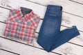 Plaid shirt and regular jeans Royalty Free Stock Photo