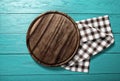 Plaid tablecloth and cutting board for pizza on blue wooden table. Wood background. Top view and mock up Royalty Free Stock Photo