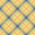 Yellow, blue and pink argyle tartan plaid. Scottish pattern fabric swatch close-up. Royalty Free Stock Photo