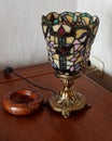 Plaidt, Germany - May 22 2022 Antique vintage lamp. The lampshade is decorated with a colored mosaic pattern of multi-colored