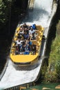 A group of people enjoying a water ride in a park Royalty Free Stock Photo