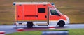 Ambulance car speeding by Royalty Free Stock Photo
