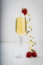 Glass of champagne sparkling wine alcohol bar trendy hotel bartender garnish