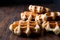 Plain Belgium Waffle on wooden surface. Royalty Free Stock Photo