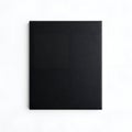 Plain black rectangular object with textured surface on white background rectangle Royalty Free Stock Photo