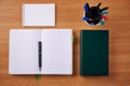 Plain Blank Open Notebooks With Stack Of Pens Inside Container Placed On Top Of A Table. Simple Empty Lined Notepads Royalty Free Stock Photo
