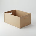 A plain, brown cardboard box with open sides and two cutout handles is placed on a Royalty Free Stock Photo