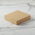 A plain, brown cardboard box sits on a white marble surface with gray veining. The Royalty Free Stock Photo