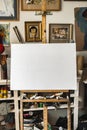 Canvas on easel at art studio indoors artistic background