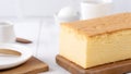 Plain classic Taiwanese traditional sponge cake Taiwanese castella kasutera on a wooden tray background table with ingredients,