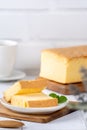 Plain classic Taiwanese traditional sponge cake Taiwanese castella kasutera on a wooden tray background table with ingredients, Royalty Free Stock Photo