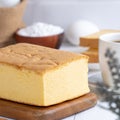 Plain classic Taiwanese traditional sponge cake Taiwanese castella kasutera on a wooden tray background table with ingredients, Royalty Free Stock Photo