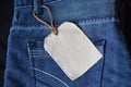 Plain clothing tag mockup on jeans background Royalty Free Stock Photo
