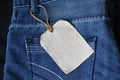 Plain clothing tag mockup on jeans background