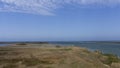 Plain coastal landscape with sea water and lakes and lagoons in Delta de l`Ebre, Catalonia