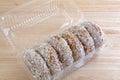 Plain coconut flake donuts in an open container Royalty Free Stock Photo